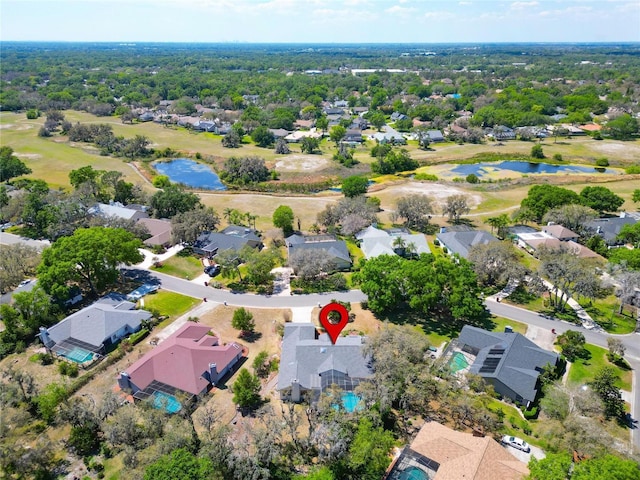 aerial view with a water view, golf course view, and a residential view