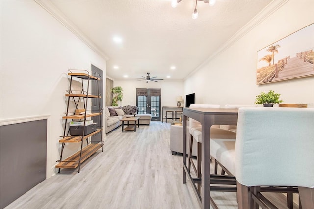 506 S Willow Ave Unit 7, Tampa, FL 33606 - dining area featuring light wood finished floors, crown molding, recessed lighting, french doors, and a ceiling fan