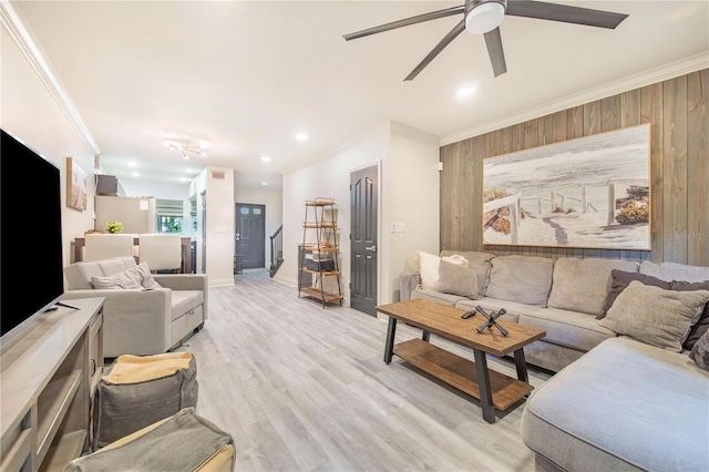 506 S Willow Ave Unit 7, Tampa, FL 33606 - living area featuring light wood finished floors, wooden walls, ceiling fan, and ornamental molding