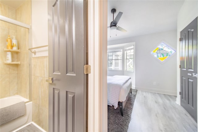 506 S Willow Ave Unit 7, Tampa, FL 33606 - bathroom with ensuite bath, baseboards, ceiling fan, and wood finished floors