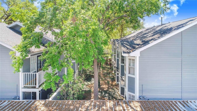 506 S Willow Ave Unit 7, Tampa, FL 33606 - view of side of property featuring a shingled roof