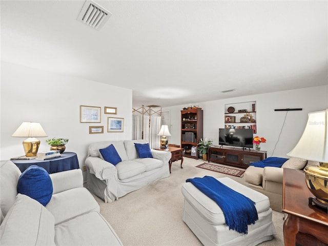 living room featuring visible vents and carpet floors