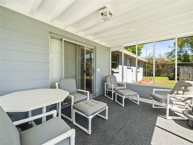 sunroom / solarium with beam ceiling