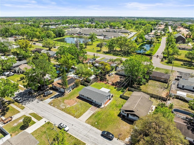 bird's eye view with a residential view and a water view