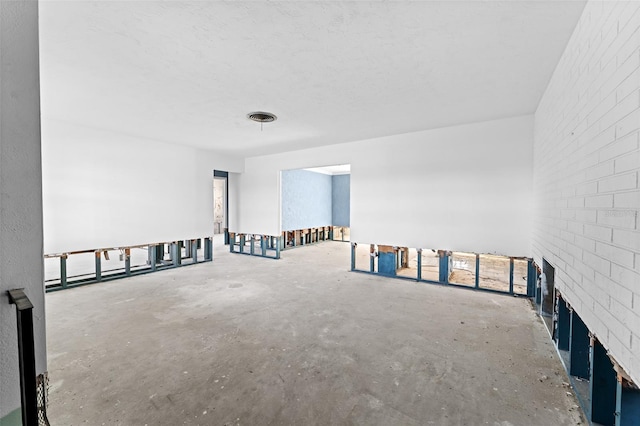 unfurnished room featuring visible vents and concrete floors