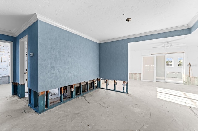empty room featuring crown molding and a textured ceiling