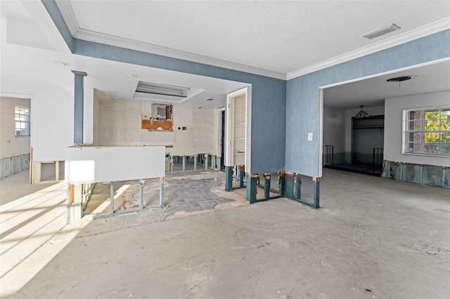 interior space with visible vents and ornamental molding