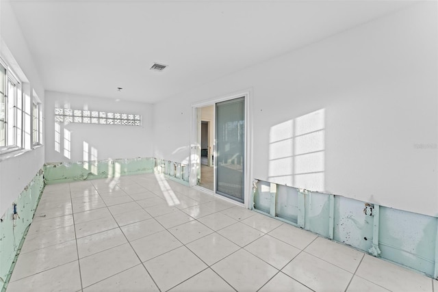 unfurnished room featuring visible vents and tile patterned flooring