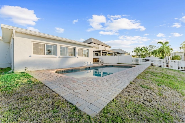view of swimming pool featuring a patio area, a fenced in pool, a lawn, and a fenced backyard