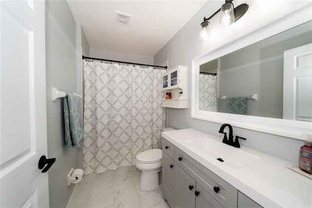 2206 Green Oaks Ln, Tampa, FL 33612 - bathroom with toilet, curtained shower, vanity, marble finish floor, and visible vents