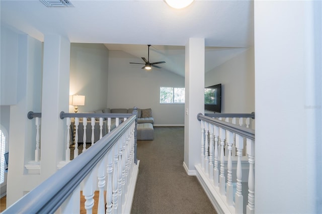 2206 Green Oaks Ln, Tampa, FL 33612 - corridor featuring an upstairs landing, vaulted ceiling, baseboards, dark carpet, and visible vents