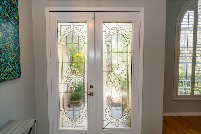 2206 Green Oaks Ln, Tampa, FL 33612 - foyer entrance featuring baseboards and wood finished floors