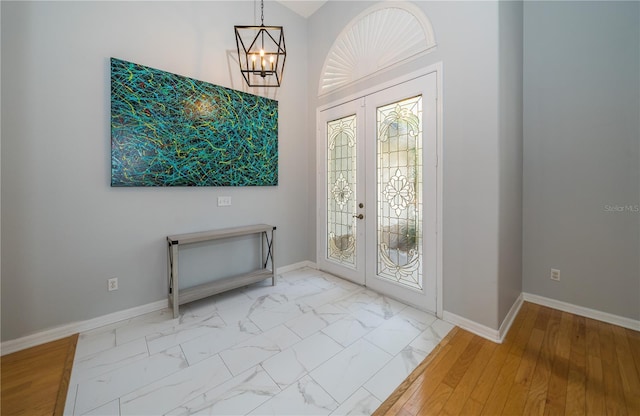 2206 Green Oaks Ln, Tampa, FL 33612 - entrance foyer with marble finish floor, baseboards, and french doors