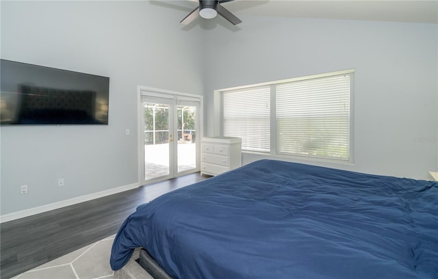 2206 Green Oaks Ln, Tampa, FL 33612 - bedroom featuring vaulted ceiling, wood finished floors, access to outside, baseboards, and ceiling fan