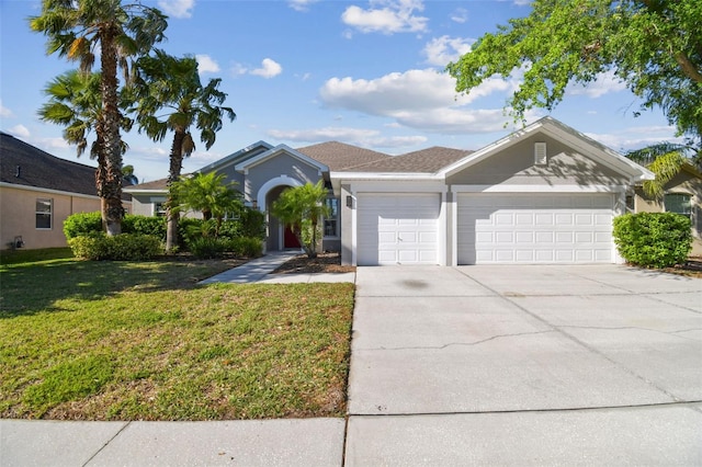 12304 Silton Peace Dr, Riverview, FL 33579 - ranch-style home with concrete driveway, stucco siding, a garage, and a front lawn