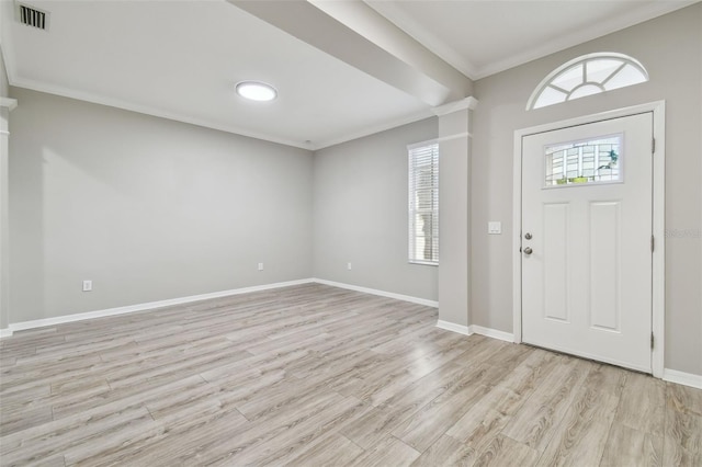 12304 Silton Peace Dr, Riverview, FL 33579 - foyer entrance with visible vents, plenty of natural light, light wood-style flooring, and crown molding
