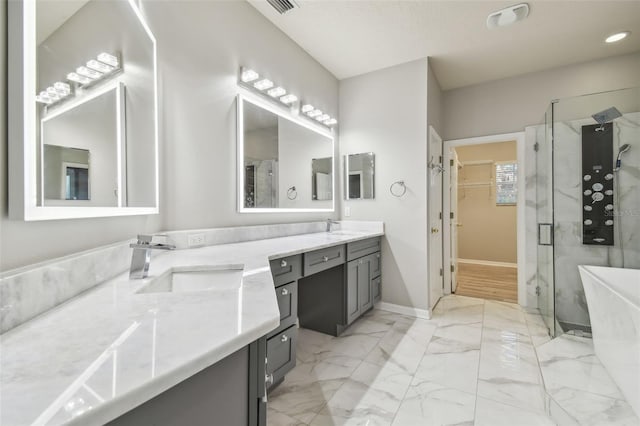12304 Silton Peace Dr, Riverview, FL 33579 - full bath with a sink, marble finish floor, a stall shower, and double vanity