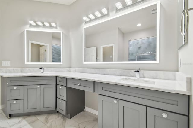 12304 Silton Peace Dr, Riverview, FL 33579 - bathroom with double vanity, marble finish floor, and a sink
