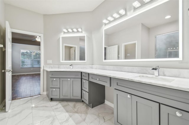 12304 Silton Peace Dr, Riverview, FL 33579 - bathroom featuring baseboards, ceiling fan, double vanity, marble finish floor, and a sink