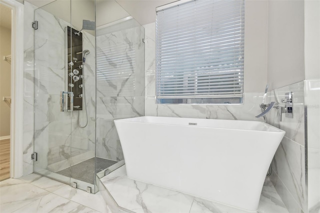 12304 Silton Peace Dr, Riverview, FL 33579 - full bathroom featuring a marble finish shower, marble finish floor, and a freestanding bath
