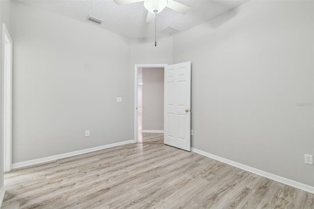 12304 Silton Peace Dr, Riverview, FL 33579 - unfurnished room with baseboards, visible vents, light wood finished floors, and ceiling fan