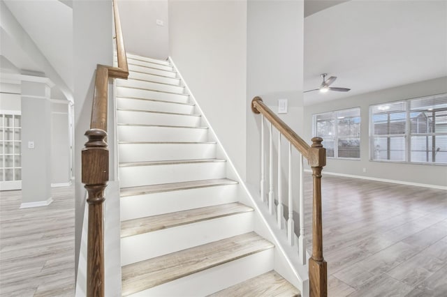 12304 Silton Peace Dr, Riverview, FL 33579 - stairway with wood finished floors, baseboards, and ceiling fan