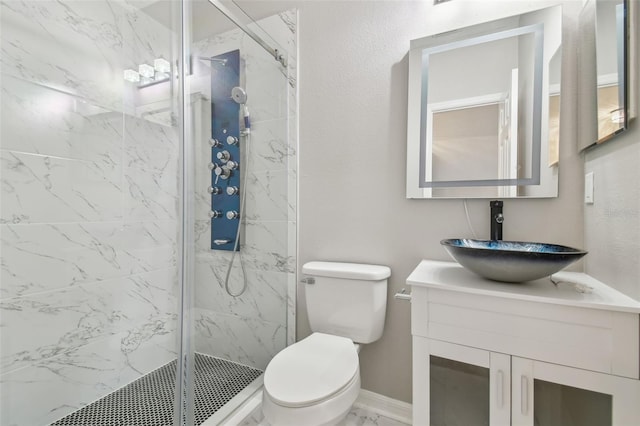12304 Silton Peace Dr, Riverview, FL 33579 - full bathroom featuring vanity, baseboards, a marble finish shower, toilet, and marble finish floor