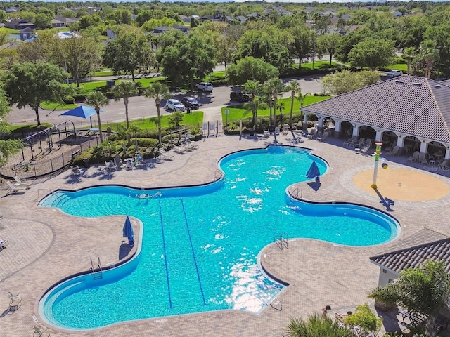 12304 Silton Peace Dr, Riverview, FL 33579 - community pool with a patio and fence
