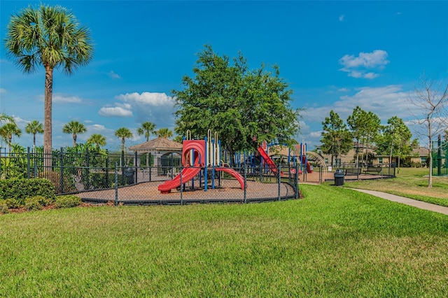 12304 Silton Peace Dr, Riverview, FL 33579 - communal playground featuring a lawn and fence