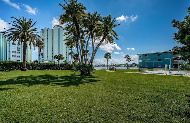 6201 2nd St E Unit 89, St Pete Beach, FL 33706 - view of home's community featuring a lawn and a water view