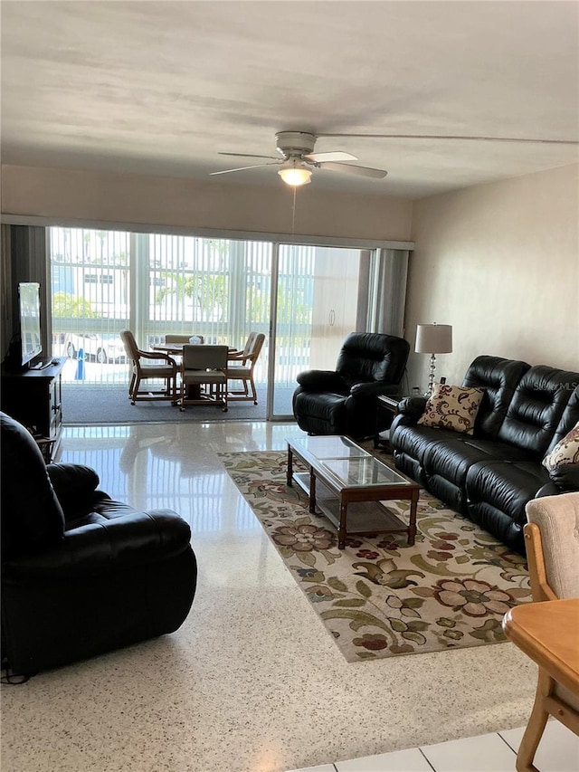 6201 2nd St E Unit 89, St Pete Beach, FL 33706 - living area with speckled floor and a ceiling fan