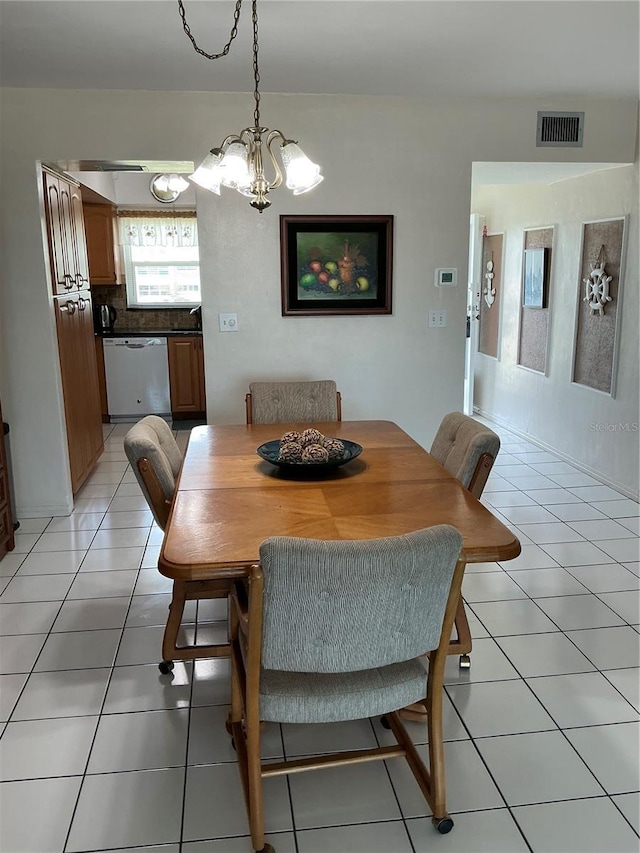 6201 2nd St E Unit 89, St Pete Beach, FL 33706 - dining area featuring visible vents, a notable chandelier, and light tile patterned floors