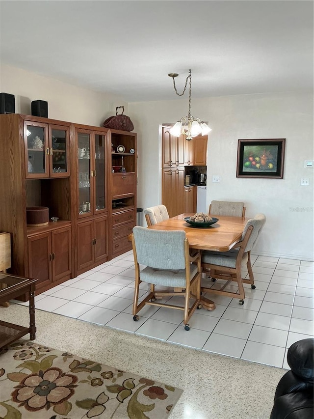 6201 2nd St E Unit 89, St Pete Beach, FL 33706 - dining room with light speckled floor and a notable chandelier