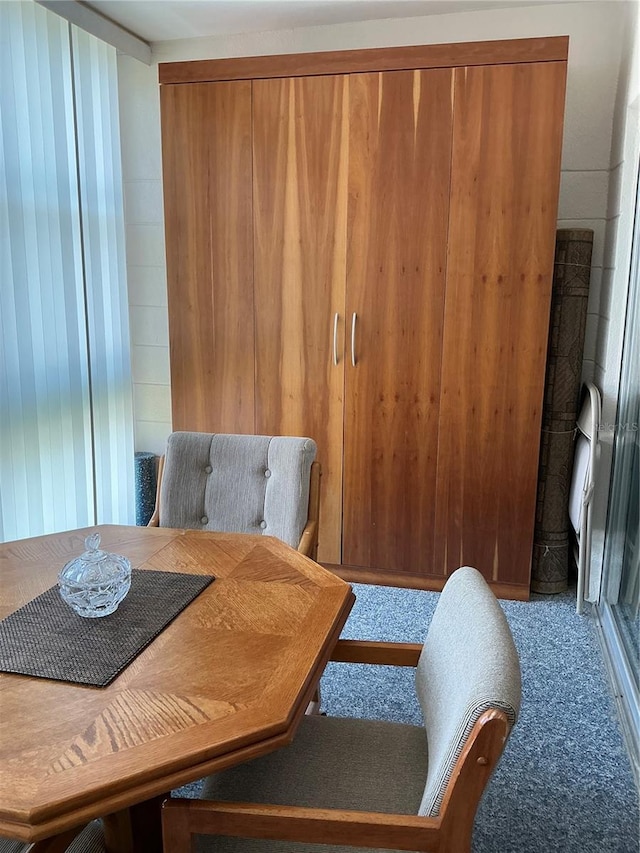 6201 2nd St E Unit 89, St Pete Beach, FL 33706 - dining room with wood walls and carpet floors