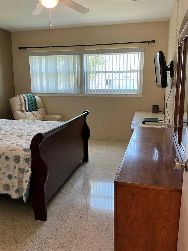 6201 2nd St E Unit 89, St Pete Beach, FL 33706 - bedroom featuring speckled floor, baseboards, and ceiling fan
