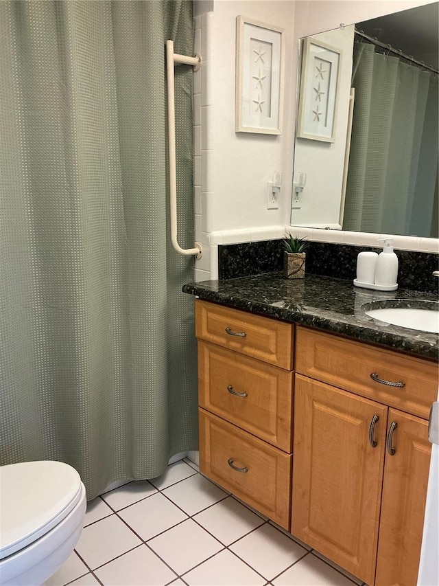6201 2nd St E Unit 89, St Pete Beach, FL 33706 - full bathroom featuring a shower with curtain, tile patterned floors, vanity, and toilet
