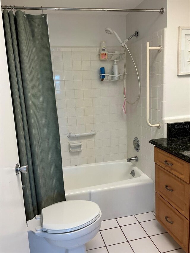 6201 2nd St E Unit 89, St Pete Beach, FL 33706 - full bath with toilet, vanity, tile patterned floors, and shower / bathtub combination with curtain