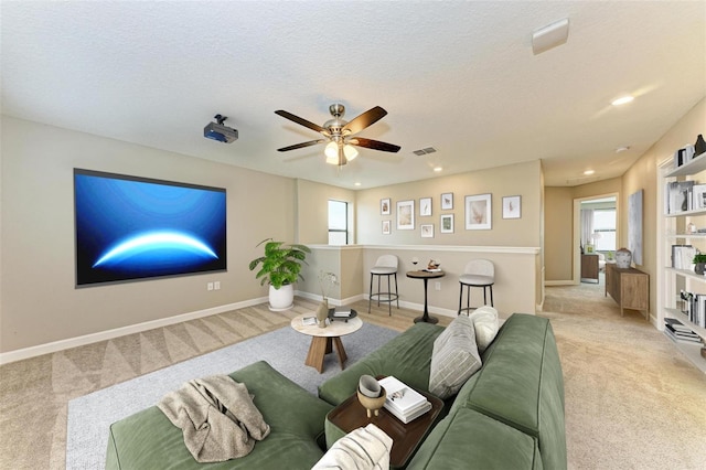 9917 Ivory Dr, Ruskin, FL 33573 - living area featuring carpet floors, healthy amount of natural light, ceiling fan, recessed lighting, and a textured ceiling