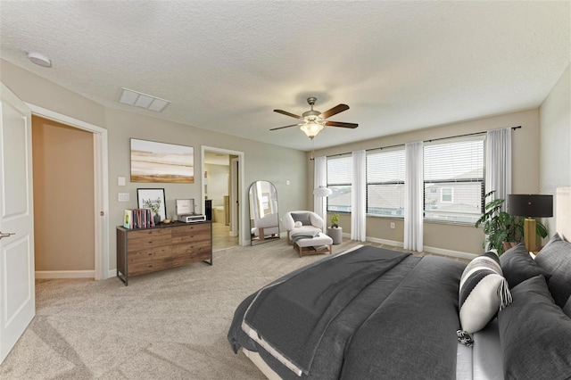 9917 Ivory Dr, Ruskin, FL 33573 - bedroom featuring light colored carpet, a ceiling fan, and a textured ceiling