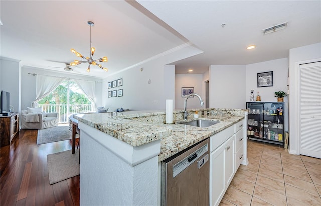 700 S Harbour Island Blvd Unit 404, Tampa, FL 33602 - kitchen with visible vents, a sink, a chandelier, open floor plan, and stainless steel dishwasher