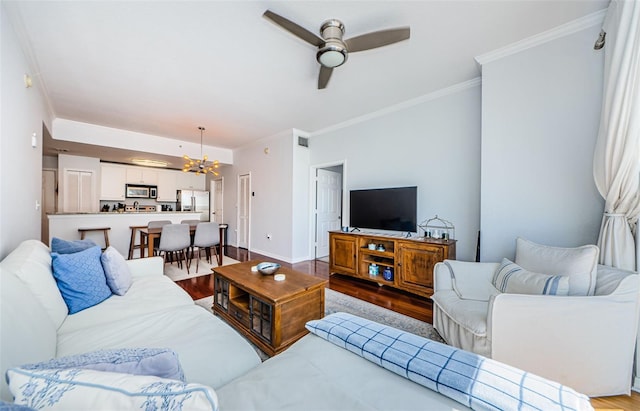 700 S Harbour Island Blvd Unit 404, Tampa, FL 33602 - living area with dark wood-style floors, ceiling fan with notable chandelier, baseboards, and ornamental molding