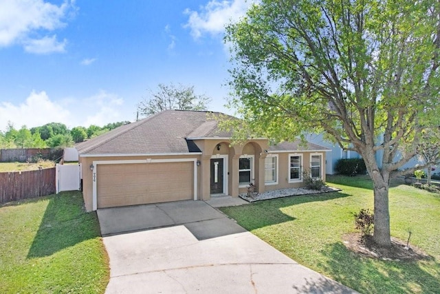 ranch-style home featuring driveway, fence, an attached garage, a front lawn, and stucco siding