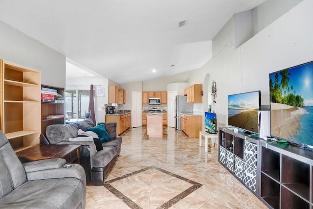 living area with marble finish floor, arched walkways, lofted ceiling, and visible vents