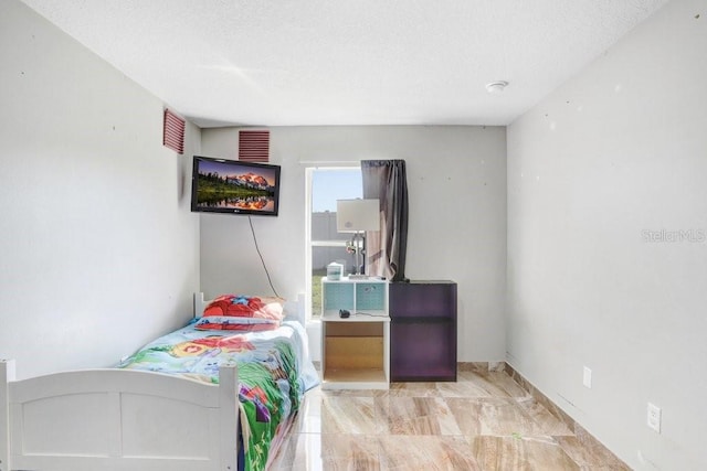 bedroom with a textured ceiling