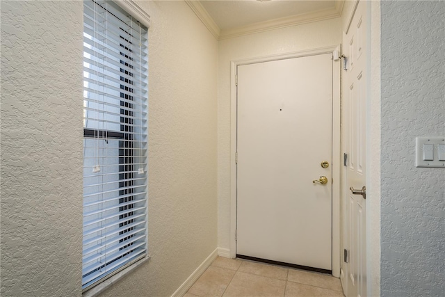720 Lyndhurst St Unit 1121, Dunedin, FL 34698 - doorway with a textured wall, light tile patterned flooring, crown molding, and baseboards