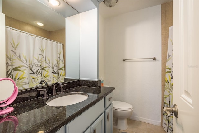 720 Lyndhurst St Unit 1121, Dunedin, FL 34698 - bathroom featuring vanity, toilet, tile patterned flooring, and baseboards