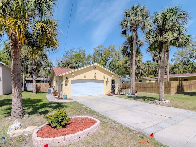 5433 Palmetto Rd, New Port Richey, FL 34652 - view of front facade with stucco siding, concrete driveway, an attached garage, and central air condition unit