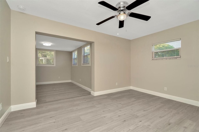 7323 Andre Dr, Zephyrhills, FL 33541 - unfurnished room with light wood finished floors, baseboards, and a ceiling fan