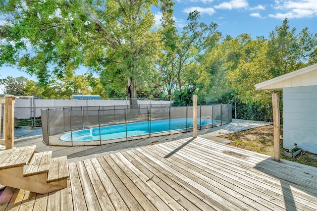 7323 Andre Dr, Zephyrhills, FL 33541 - view of swimming pool featuring a fenced backyard, a deck, and a fenced in pool