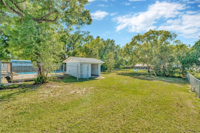 7323 Andre Dr, Zephyrhills, FL 33541 - view of yard featuring an outbuilding and a fenced backyard